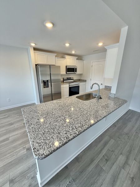 Furnished interior view inside a new home in Stone Fort Meadows, Manchester (Image 2).
