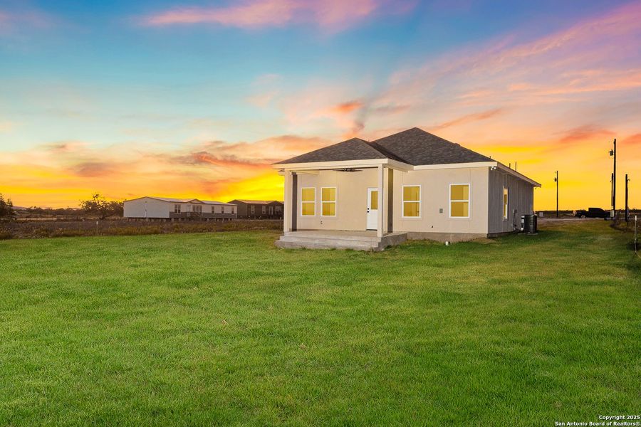 Front exterior of a new home in , La Vernia, TX, highlighting curb appeal (Image 25).