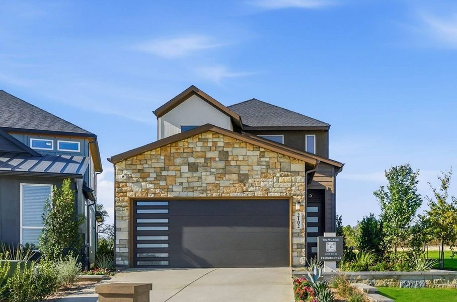 Front exterior of a new home in Prominence, San Antonio, TX, highlighting curb appeal (Image 25). Front exterior of a new home in Prominence, San Antonio, TX, highlighting curb appeal (Image 25).