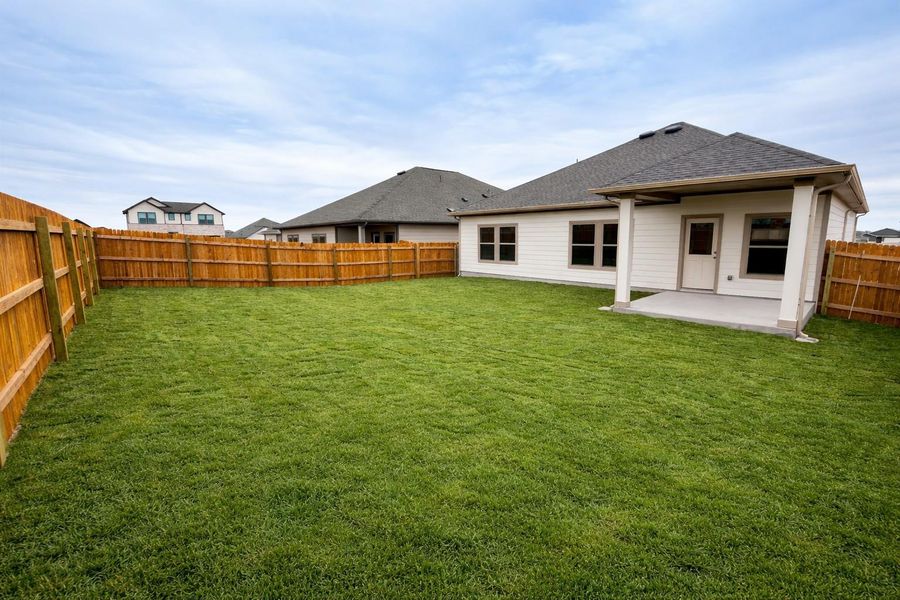 Rear of Home and Private Backyard