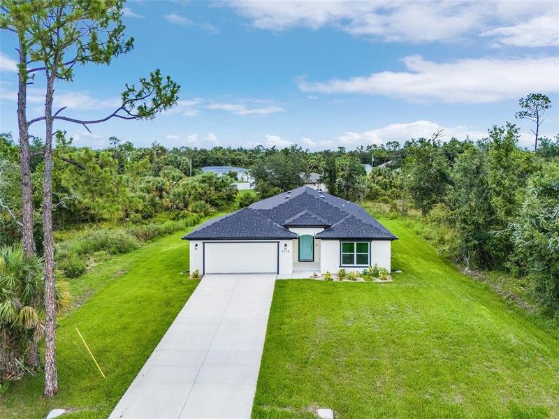 Front exterior of a new home in , North Port, FL, highlighting curb appeal (Image 23).