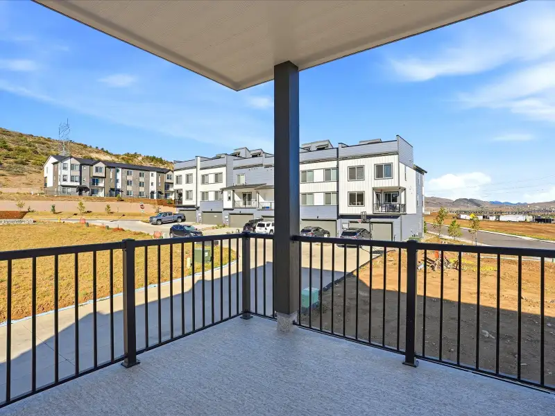 Exterior details and patio area of a home in Three Hills, Morrison (Image 17).