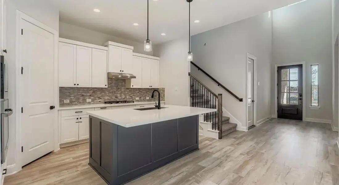 Furnished interior view inside a new home in 6 Creeks, Kyle (Image 4).