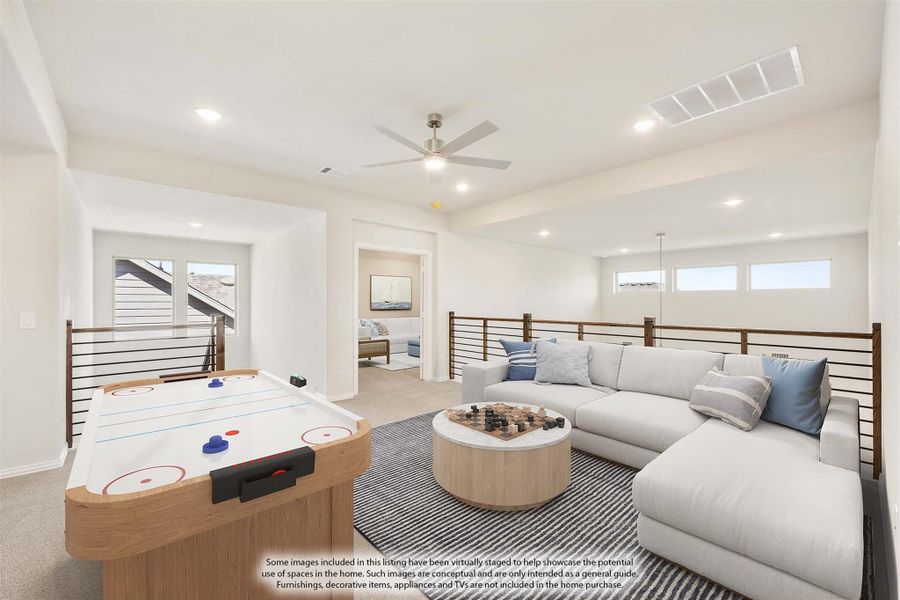 Upstairs loft game room with air hockey table, sectional sofa, and ceiling fan
