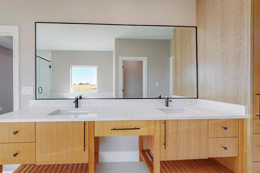 Bathroom featuring vanity and walk in shower