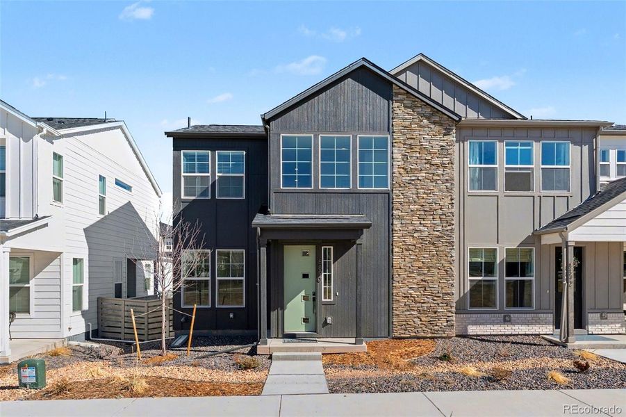 Front exterior of a new home in Trumark Homes at Sterling Ranch, Littleton, CO, highlighting curb appeal (Image 2). Front exterior of a new home in Trumark Homes at Sterling Ranch, Littleton, CO, highlighting curb appeal (Image 2).