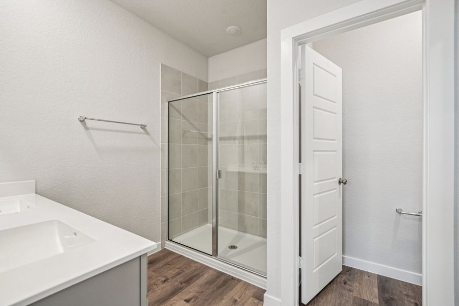 A bathroom with a glass shower.
