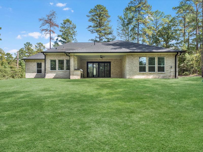 Exterior details and patio area of a home in , New Waverly (Image 16). Exterior details and patio area of a home in , New Waverly (Image 16).