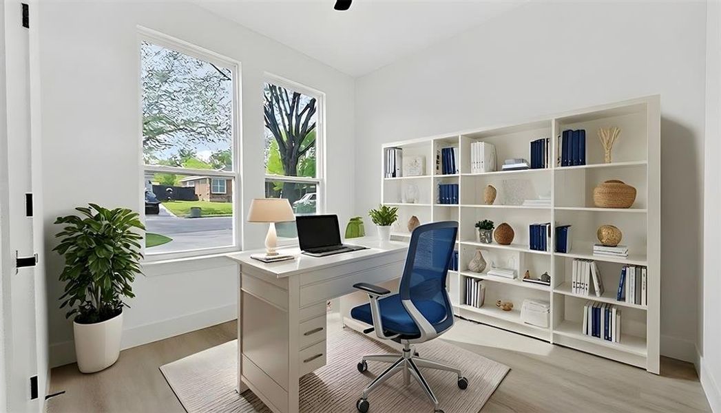 Office space with light wood finished floors and baseboards