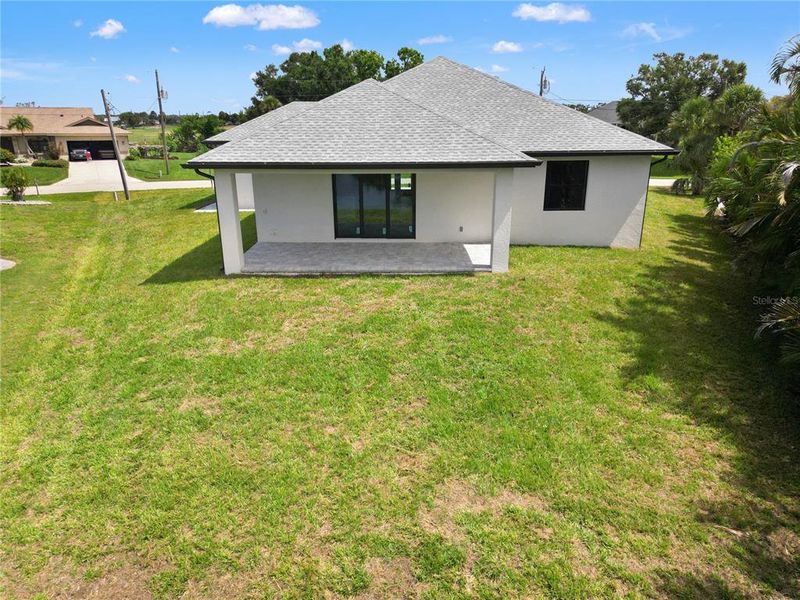 Front exterior of a new home in , Rotonda West, FL, highlighting curb appeal (Image 12).