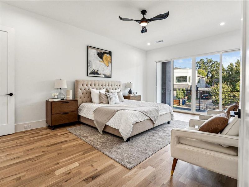 Bedroom featuring access to outside, light hardwood / wood-style floors, and ceiling fan