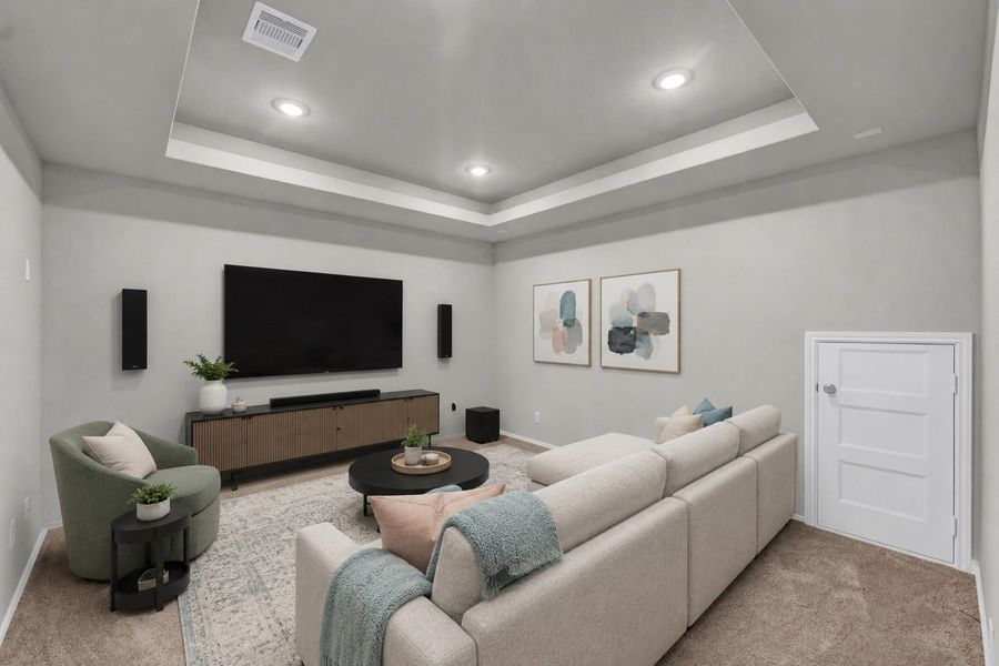 The dedicated media room showcases a striking tray ceiling with integrated recessed lighting and comfortable plush carpeting.**Virtually staged The dedicated media room showcases a striking tray ceiling with integrated recessed lighting and comfortable plush carpeting.**Virtually staged