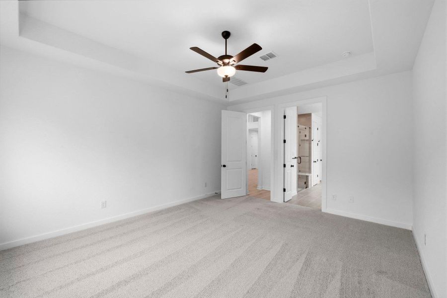 Primary Bedroom with elevated ceiling