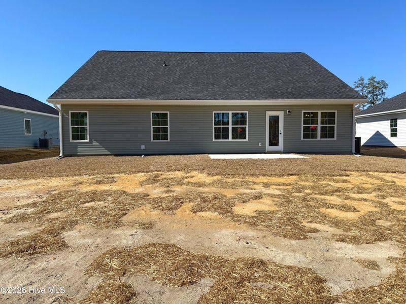 Exterior details and patio area of a home in Wood Creek Landing, Leland (Image 3).