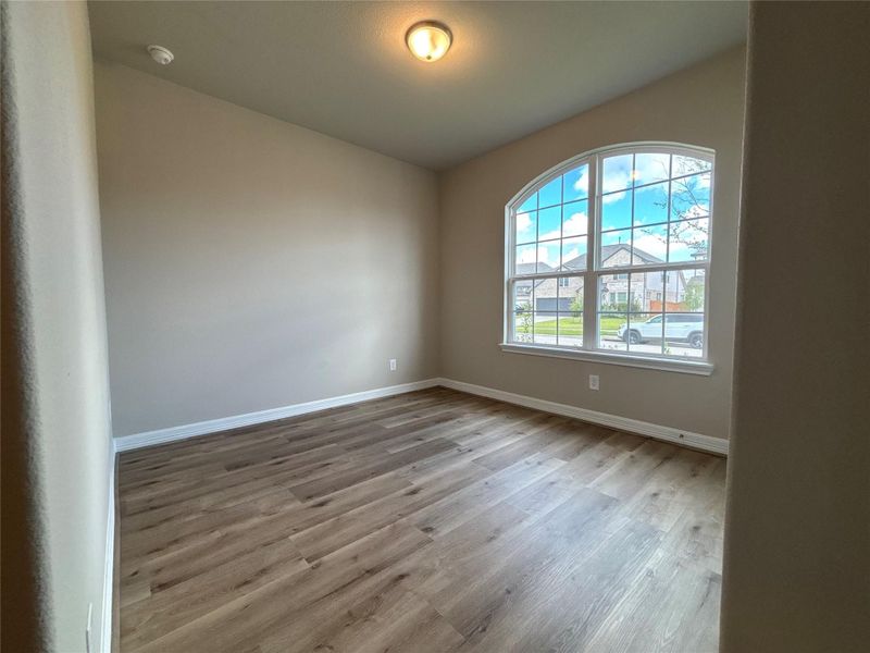 Spacious, unfurnished interior of a new home in Sunterra, Katy (Image 32).