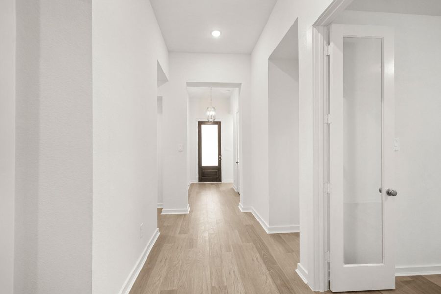 An inviting entryway featuring a beautiful door that sets the tone for the home, warm and welcoming style. An inviting entryway featuring a beautiful door that sets the tone for the home, warm and welcoming style.