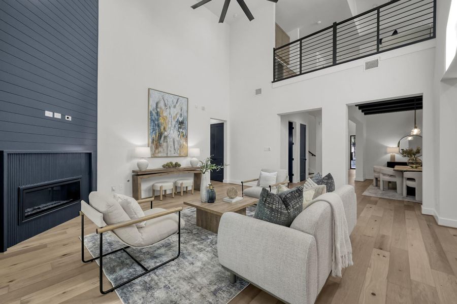 Open-concept family room showcasing connection to kitchen and dining spaces. Open-concept family room showcasing connection to kitchen and dining spaces.