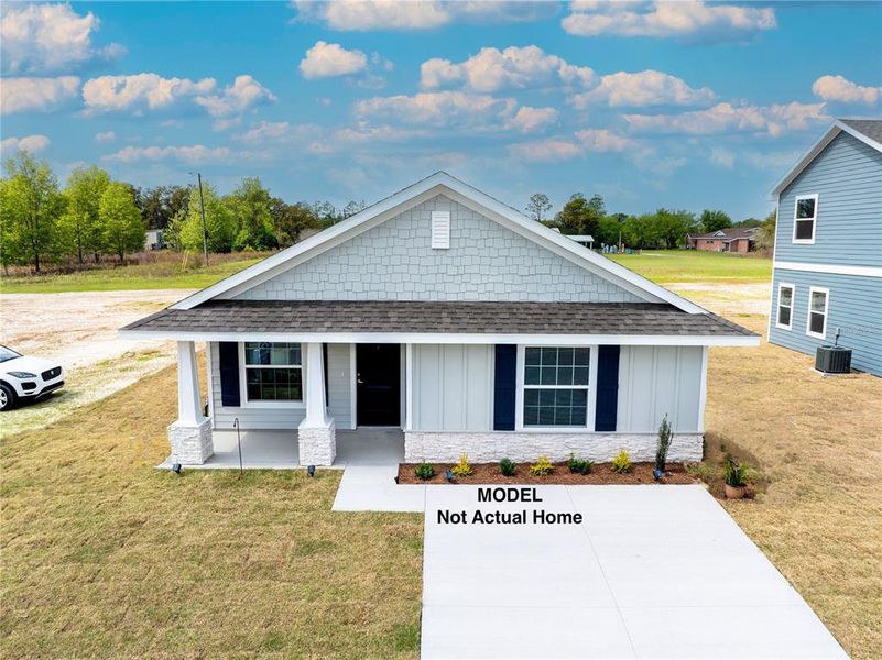 Front exterior of a new home in Rolling Hills, Bell, FL, highlighting curb appeal (Image 1).