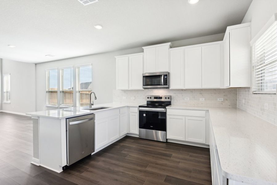 Kitchen in the Medina floorplan at a Meritage Homes community.