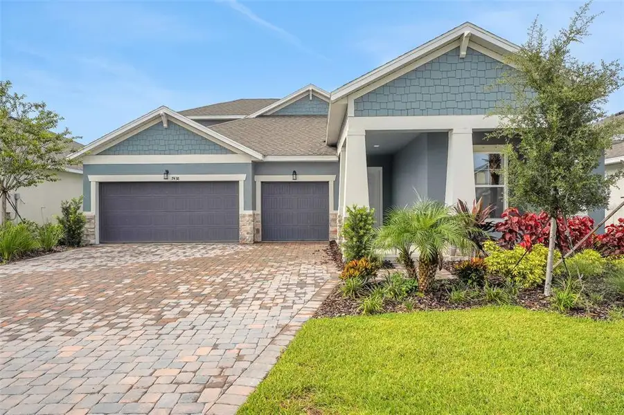 Front exterior of a new home in Seaire, Parrish, FL, highlighting curb appeal (Image 1). Front exterior of a new home in Seaire, Parrish, FL, highlighting curb appeal (Image 1).