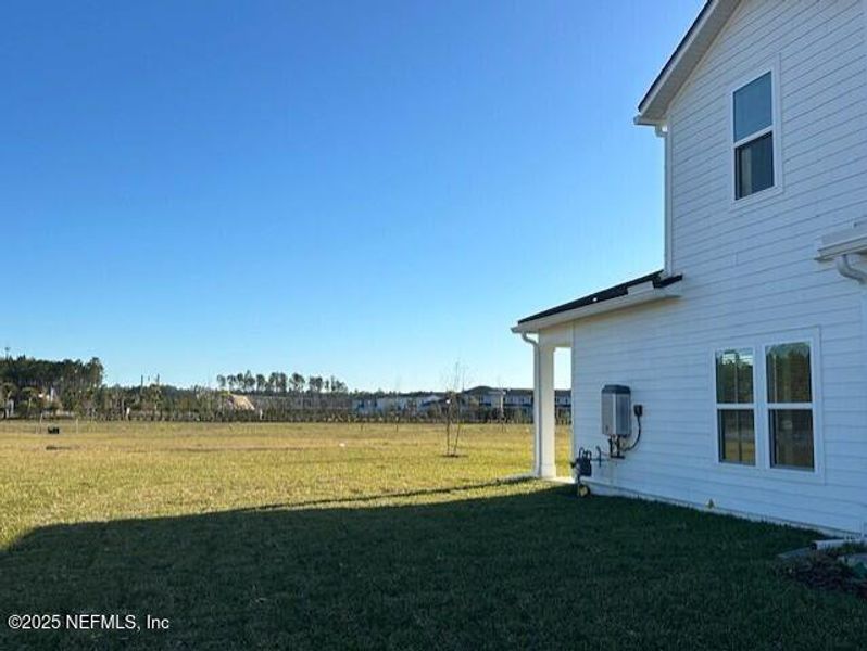 Exterior details and patio area of a home in Brook Forest - Villas, St. Augustine (Image 3).