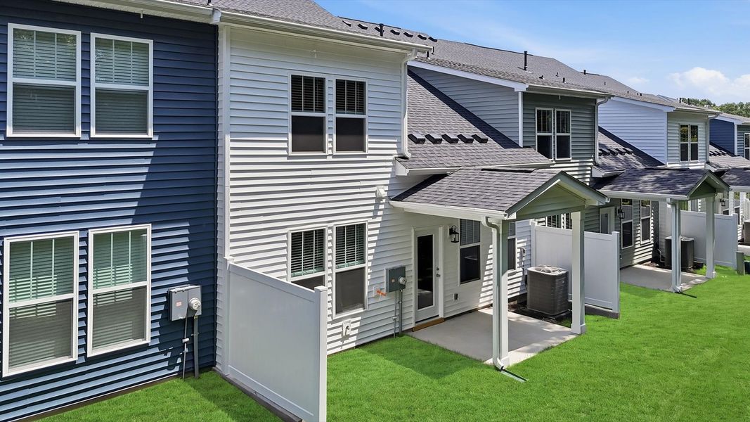 Tasteful rear porch provides a peaceful retreat and effortless indoor-outdoor flow