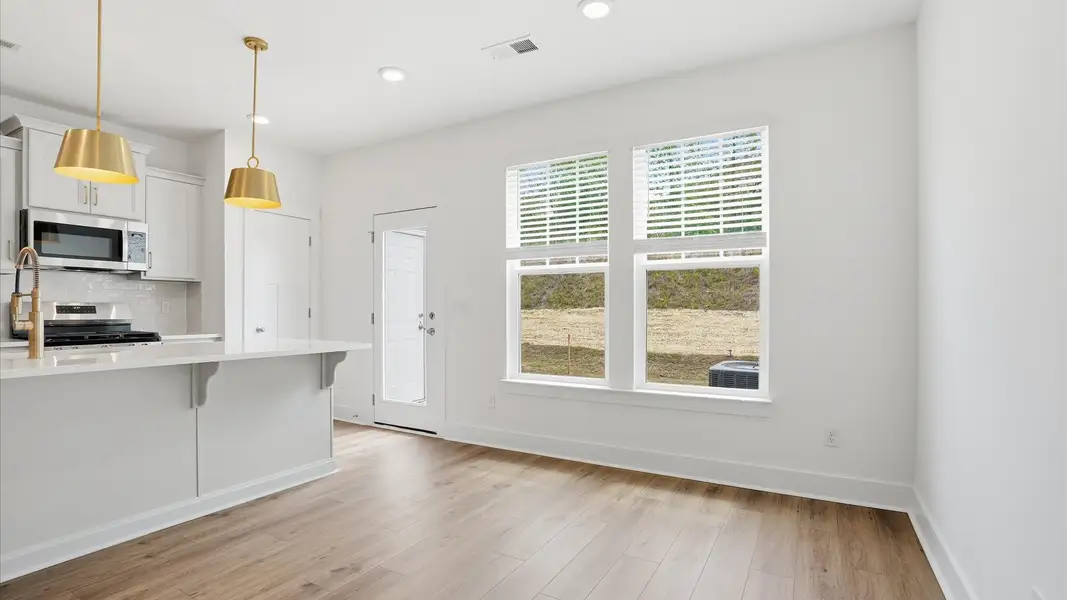 This charming breakfast nook blends comfort and function, providing a casual dining space with timeless appeal