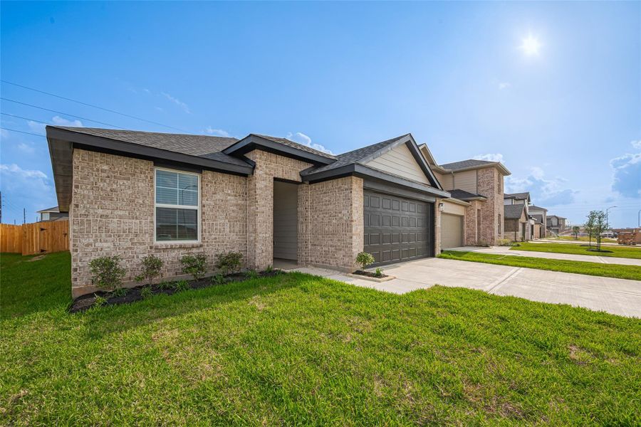 Front exterior of a new home in Tamarron, Fulshear, TX, highlighting curb appeal (Image 1). Front exterior of a new home in Tamarron, Fulshear, TX, highlighting curb appeal (Image 1).
