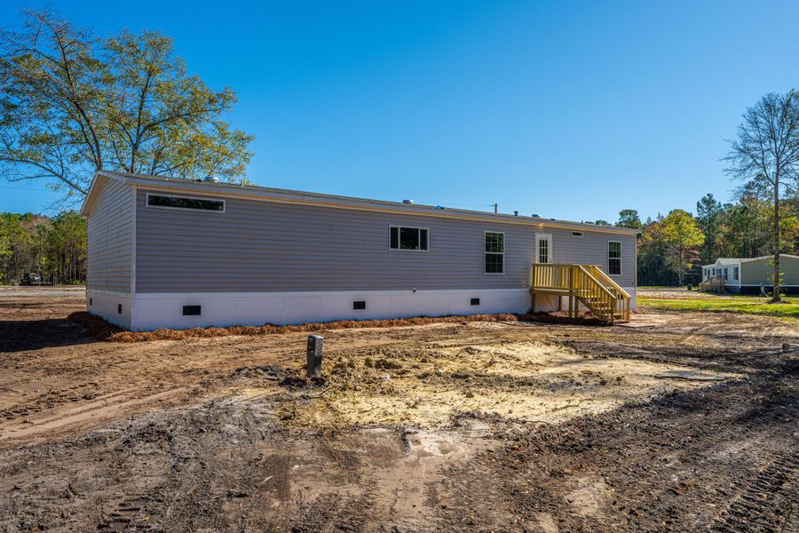 Exterior details and patio area of a home in , Pinopolis (Image 21).