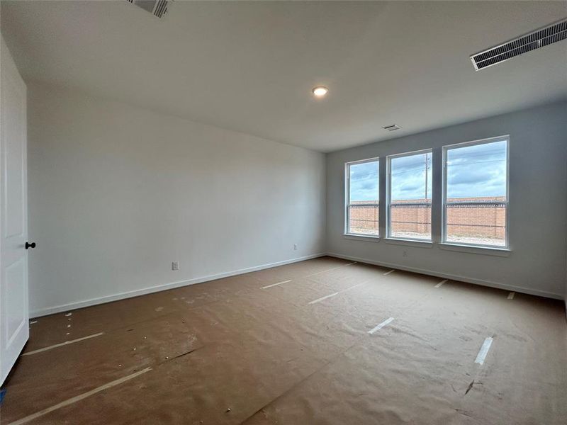 The main bedroom offers a spacious retreat with elegant design and ample natural light. Its thoughtful layout provides comfort and privacy, making it a perfect space to relax and unwind.