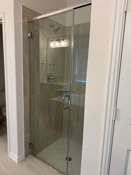 Luxurious primary bathroom with dual vanities, soaking tub, and separate walk in shower. Luxurious primary bathroom with dual vanities, soaking tub, and separate walk in shower.