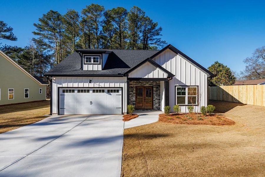Front exterior of a new home in , Carrollton, GA, highlighting curb appeal (Image 28).
