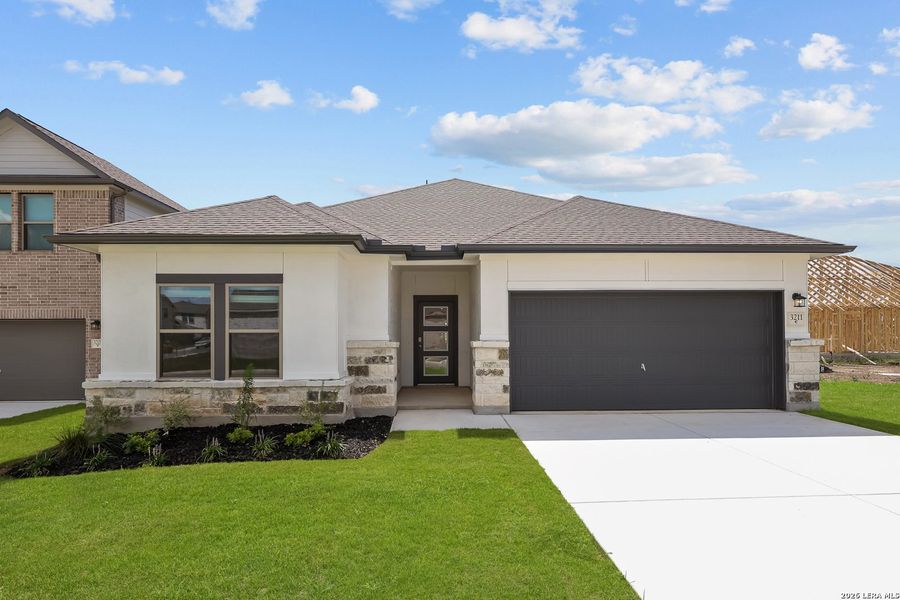 Front exterior of a new home in Summerlin, San Antonio, TX, highlighting curb appeal (Image 25).