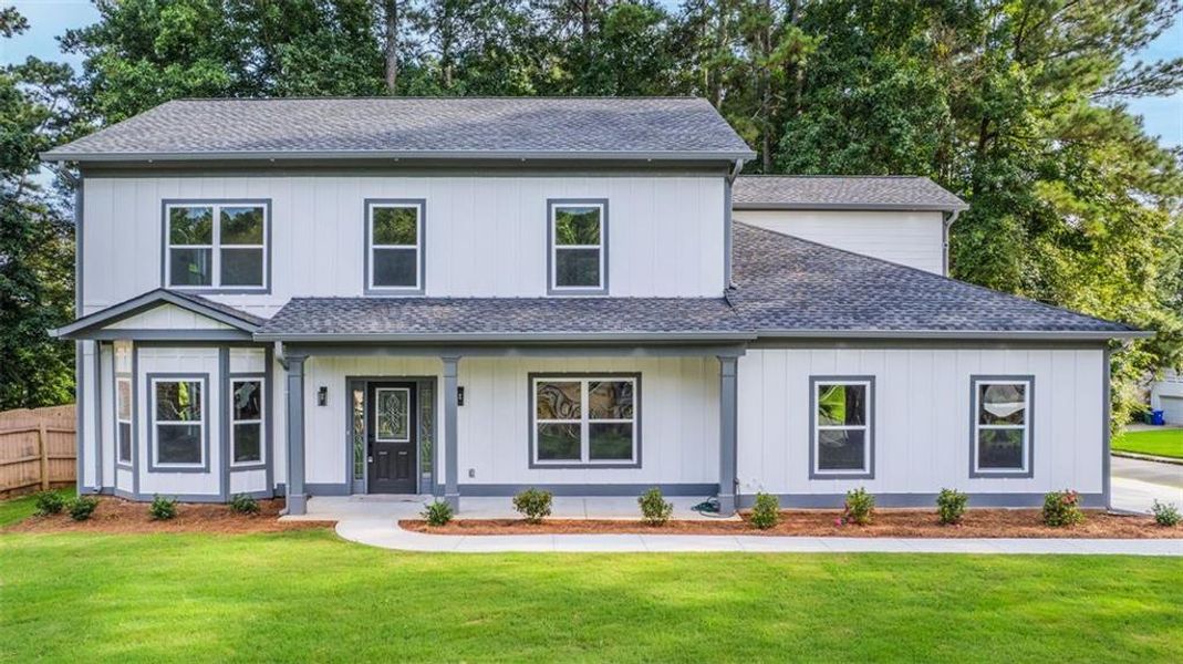 Front exterior of a new home in , Lithonia, GA, highlighting curb appeal (Image 22).