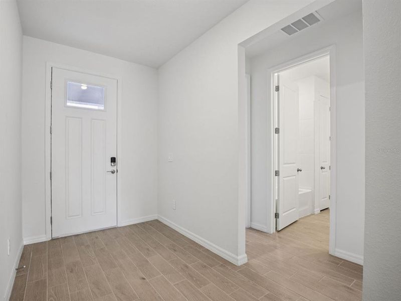 Spacious, unfurnished interior of a new home in Coasterra - Reserve Series, Palmetto (Image 24).