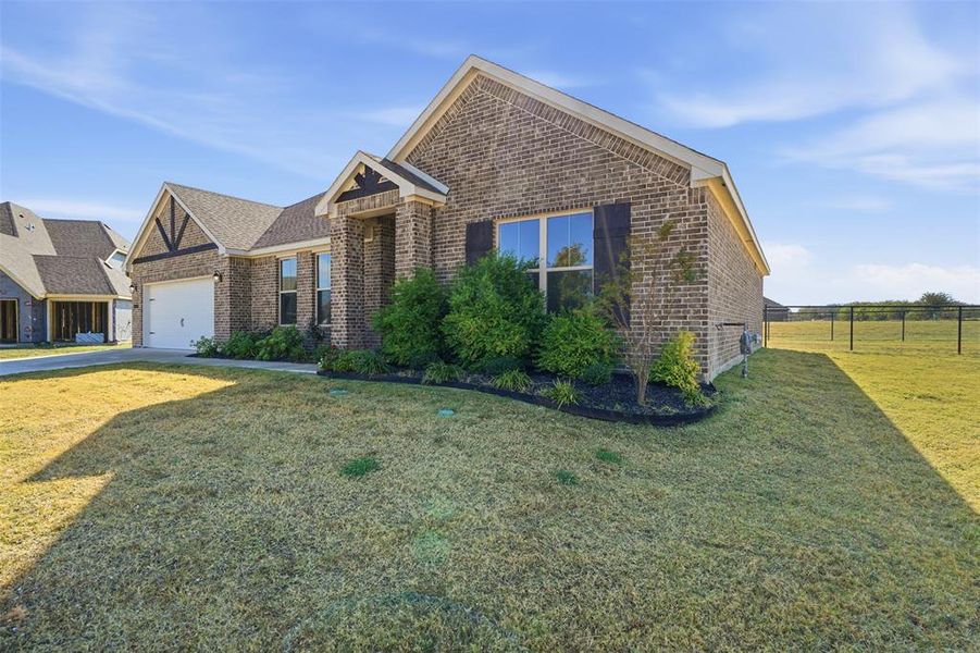 Front exterior of a new home in Wildcat Ridge, Godley, TX, highlighting curb appeal (Image 25). Front exterior of a new home in Wildcat Ridge, Godley, TX, highlighting curb appeal (Image 25).