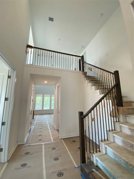 Entry Foyer with soaring ceiling and grand staircase