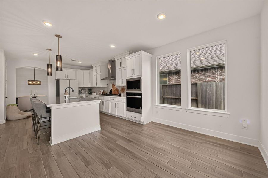 The spacious breakfast area flows seamlessly into the kitchen and family room, making everyday living effortless. The spacious breakfast area flows seamlessly into the kitchen and family room, making everyday living effortless.