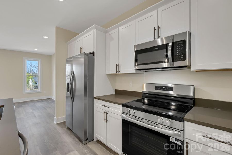 White cabinets with very unique quartz countertops