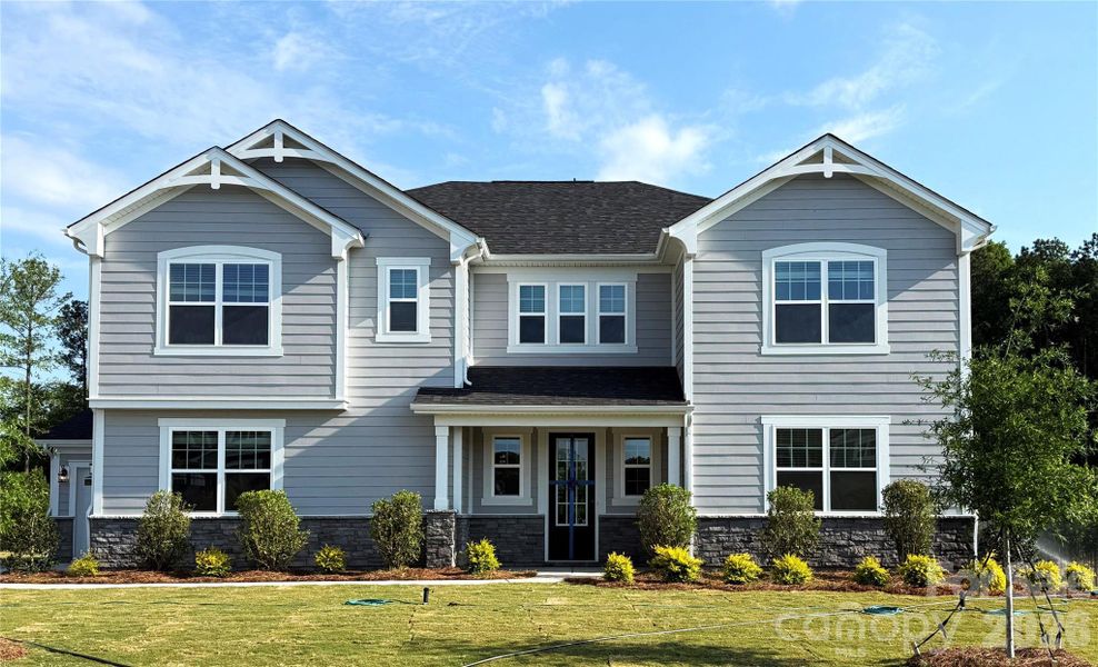 Front exterior of a new home in Blair Place, Monroe, NC, highlighting curb appeal (Image 1). Front exterior of a new home in Blair Place, Monroe, NC, highlighting curb appeal (Image 1).