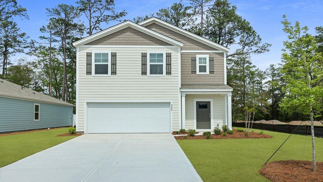 Front exterior of a new home in Hillcrest, Ravenel, SC, highlighting curb appeal (Image 1). Front exterior of a new home in Hillcrest, Ravenel, SC, highlighting curb appeal (Image 1).