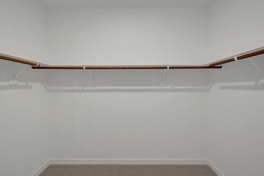 Primary walk-in closet Primary walk-in closet