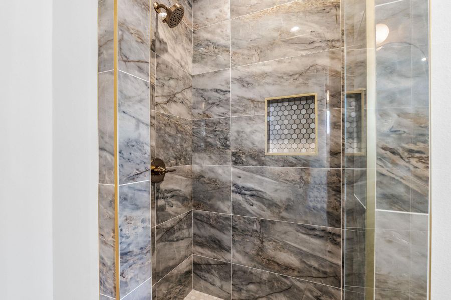 Full bathroom with tiled shower