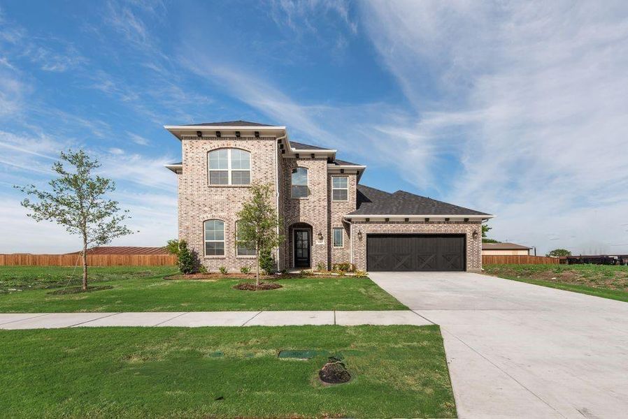 Front exterior of a new home in Villages of Creekwood, Frisco, TX, highlighting curb appeal (Image 22). Front exterior of a new home in Villages of Creekwood, Frisco, TX, highlighting curb appeal (Image 22).