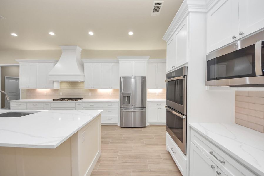 This is truly the perfect room for cooking and entertaining. The 3-door refrigerator is also included!