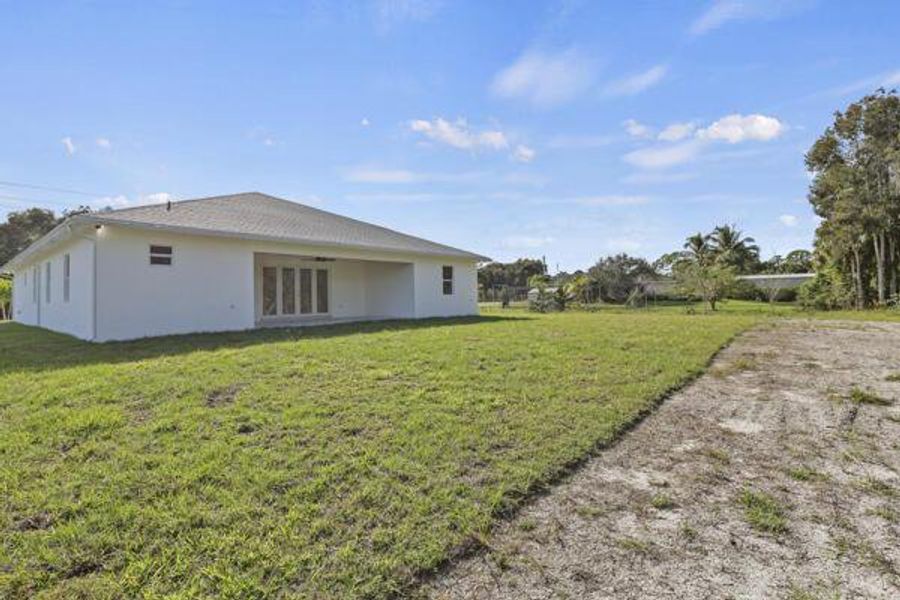 Exterior details and patio area of a home in , Loxahatchee (Image 27).