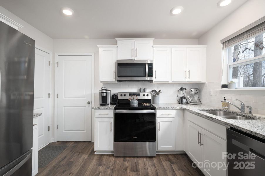 Tile Backsplash and shaker-style cabinetry in Kitchen Tile Backsplash and shaker-style cabinetry in Kitchen