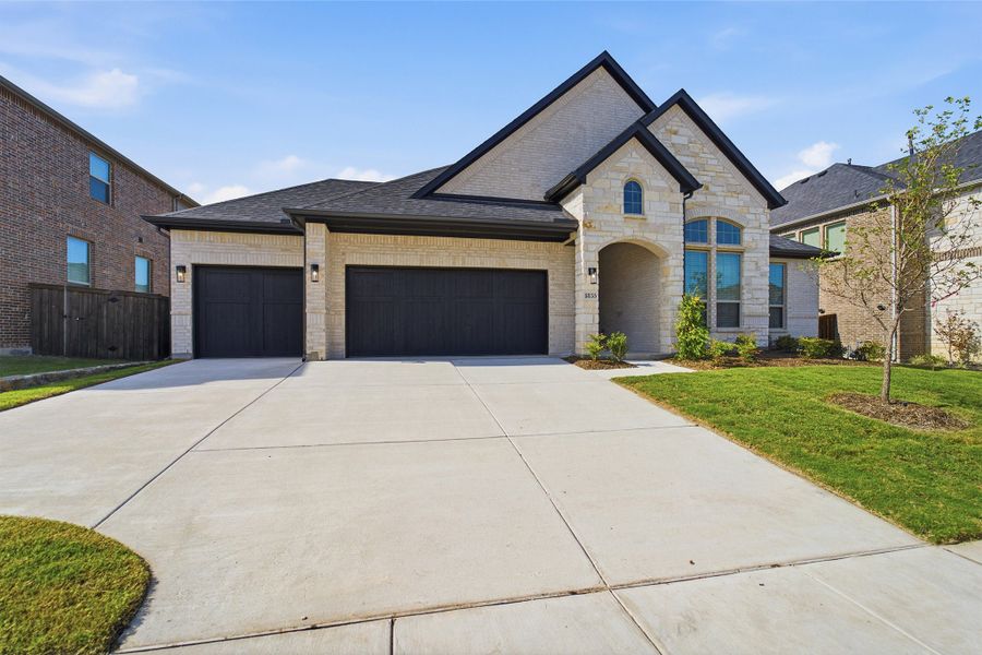 Front exterior of a new home in Sonoma Verde, Heath, TX, highlighting curb appeal (Image 29). Front exterior of a new home in Sonoma Verde, Heath, TX, highlighting curb appeal (Image 29).