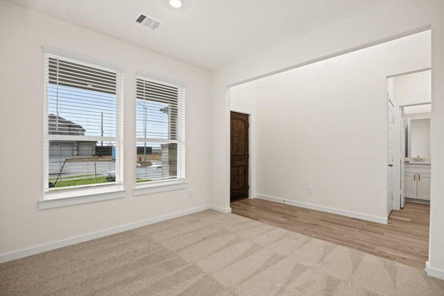 Spacious, unfurnished interior of a new home in Creekhaven, Iowa Colony (Image 11).