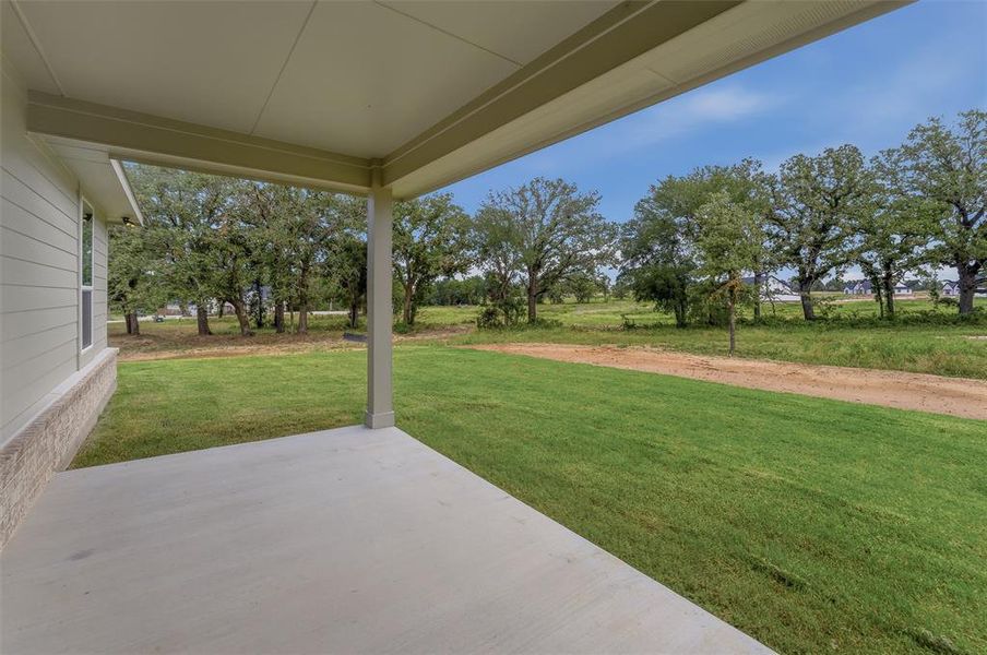 Exterior details and patio area of a home in Oak Grove Addition, Springtown (Image 17).